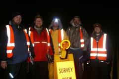 Image of A late-night amphibian rescue squad keeps frogs and salamanders moving on their merry way. Pictured left-to-right are Dave Clapp, Evan Madlinger, Mike VanClef, Jim Angley, and MacKenzie Hall.