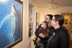 Image of Family enjoying the beautiful watercolor illustration of a Humpback Whale by James Fiorentino.
